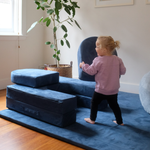 Possum Play Tunnels & Shields in Sailor - Child picking up and moving shield pieces in active play