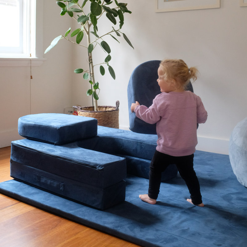 Possum Play Tunnels & Shields in Sailor - Child picking up and moving shield pieces in active play